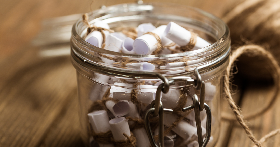 Jar full of rolled up notes