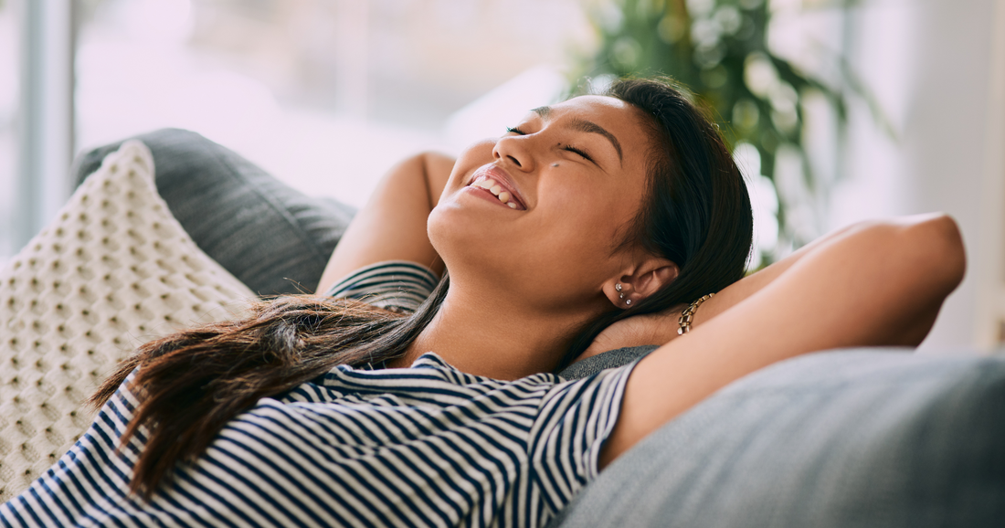 woman relaxes after planning her month around her hormone cycle
